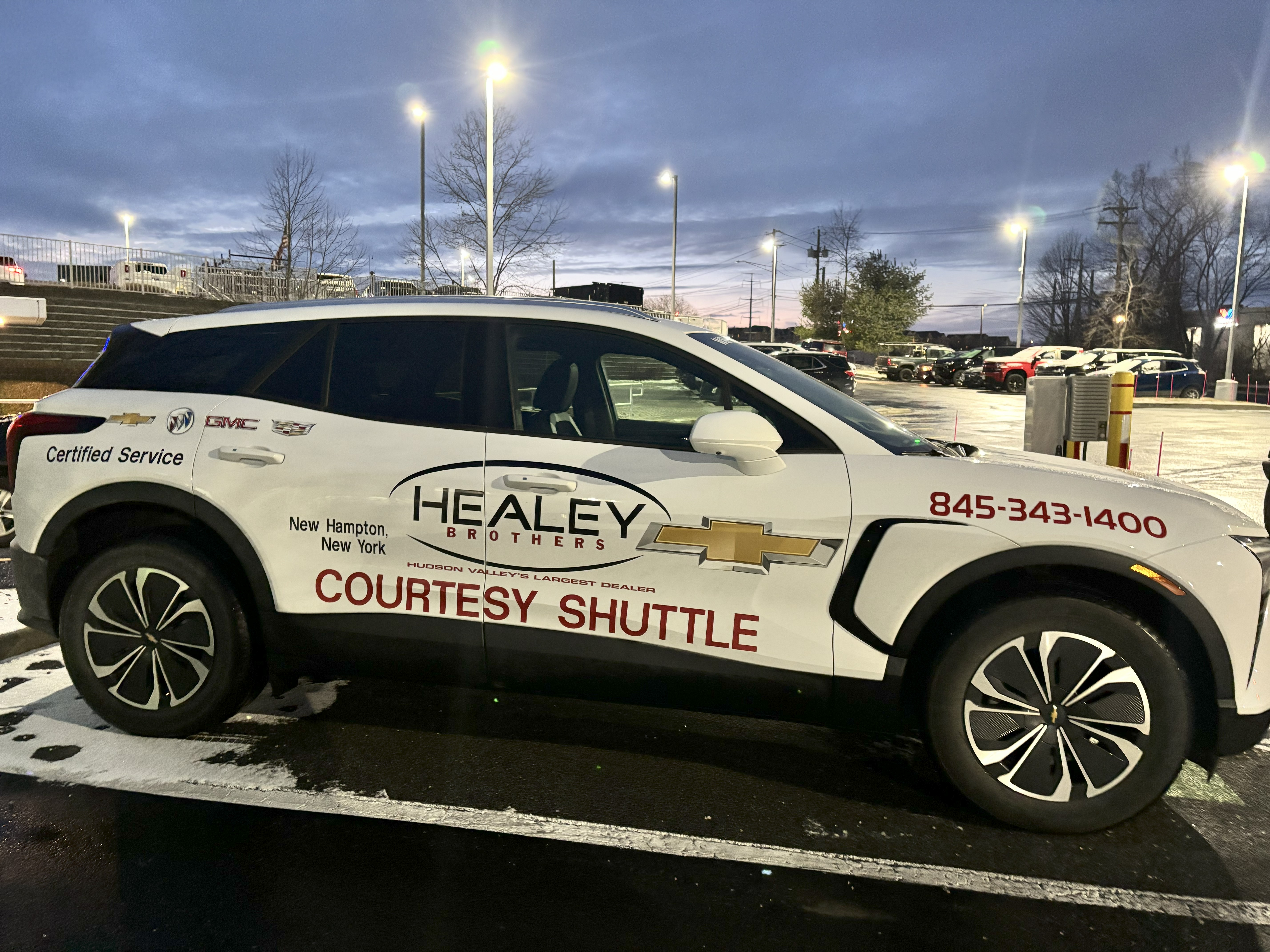 Mobile business branding graphics applied to a courtesy shuttle